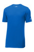 A blue Nike Dri-FIT Cotton/Poly Tee with a logo on the sleeve, displayed on a plain background. A blue Nike Dri-FIT Cotton/Poly Tee with a logo on the sleeve, displayed on a plain background.