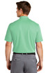 A man in a mint green polo shirt, featuring a collar and short sleeves, viewed from the back. The shirt has a logo.