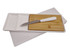A white serving platter with a bamboo cutting board and a silver knife with a white handle. A white serving platter with a bamboo cutting board and a silver knife with a white handle.