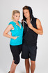 A teal sleeveless zip hoodie and a black sleeveless zip hoodie on models, both featuring a hood and pockets.