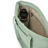 A mint green tote bag interior with a drink bottle and a zipped pocket. The interior features a light beige lining.