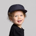 A navy cap designed for kids, featuring a structured brim and an adjustable fit.