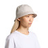 A bucket hat in a light beige colour, featuring a logo, displayed on a model with long hair.