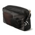 A black mesh packing cube containing various items, showcasing its organisational features and content visibility.