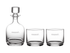 A glass decanter and two matching tumblers, all clear with a subtle logo.