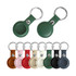 A collection of PU leather AirTag holders with keyrings in various colours including green, brown, pink, and black.