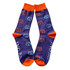 A pair of purple socks with orange cuffs and playful blue and orange lion motifs, featuring a logo.