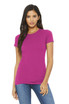A woman models a fitted, short-sleeved tee in bright pink, paired with blue jeans. The shirt features a logo.