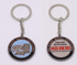 A metal keyring featuring a distinct design, with blue and silver colours, and branding on both sides.