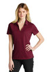 A maroon polo shirt with a collar, featuring short sleeves and a logo.