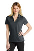 A grey Nike ladies' Dri-FIT Micro Pique 2.0 polo shirt displayed on a model, featuring a subtle logo.