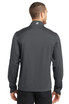 A man wearing a grey OGIO ENDURANCE Crux Soft Shell jacket, viewed from the back. The jacket has a logo on the collar.