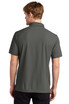 A person wearing a charcoal grey OGIO Caliber 2.0 polo shirt, viewed from the back. The shirt features a collar and short sleeves.