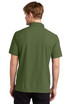 A man is wearing a dark green OGIO Caliber 2.0 polo shirt, viewed from the back. The shirt has a collar and short sleeves.