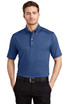 A blue OGIO Gauge Polo shirt is worn by a man standing against a plain background. The shirt features a collar and branding.