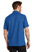 A man wearing a blue OGIO Onyx polo shirt, seen from the back, with short sleeves and a collar.