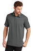 A grey polo shirt with a collar and a logo, styled on a model in a relaxed pose.
