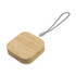 A square wireless charger set in a natural bamboo finish with a looped attachment for easy carrying.