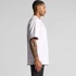 A light pink heavy tee shirt displayed on a model, featuring a relaxed fit and a logo.