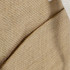 A close-up of a textured beige cooler bag with a contrasting light beige section and a logo.