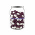 A clear jar filled with purple and white jelly beans, featuring a logo on the front.