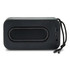 A black bass speaker with a smooth surface, featuring a USB port and a cord for easy carrying.