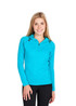 A woman wearing a vibrant turquoise half-hood top with long sleeves and a zippered neckline.