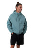 A men's zip-up hoodie in teal with a kangaroo pocket, worn with black shorts, featuring a logo.