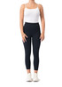 High-rise full-length leggings in black, paired with a white tank top and white sneakers.