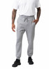 Men's three-layer cotton sandwich pants in grey, featuring an elastic waistband and side pockets. Model wears a white t-shirt.