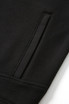 A close-up view of a black polar fleece half zip top featuring a sleek design and textured fabric.