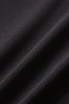 A close-up of black fabric featuring soft texture and subtle folds, suitable for high rise legging shorts.