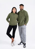 A green polar fleece half zip top worn by a woman with black leggings and a man in grey pants. Both stand together.