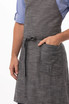 A grey bib apron featuring a pocket and a tied waist, designed for workwear use.
