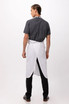 A white bib apron worn over a grey shirt, featuring an adjustable neck strap and a simple design.