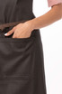 A dark apron featuring a front pocket and a contrasting brown belt. It has a logo on the fabric.
