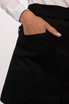 A black half bistro apron featuring a large side pocket, shown alongside a hand partially inserted into the pocket.