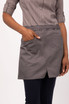 A grey half bistro apron with a pocket, worn by a person in a striped shirt and dark trousers.