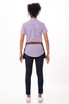 A back view of a person wearing a purple and white checked shirt, dark jeans, and a brown Memphis Waist Apron.