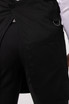 A black Largo Bib Apron with a pocket and a ring detail on the side, showcasing its workwear design.