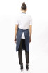 A navy Brio Bib Apron worn by a person from the back, featuring a simple design and a logo.
