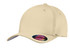 A beige cotton twill cap with a fitted design and a logo on the side.