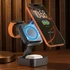 A black 3-in-1 wireless charging station features a magnetic holder for a smartphone, and holders for an Apple Watch and AirPods.