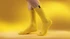Yellow heavy cotton workwear socks displayed on a model's feet against a yellow background, featuring a small logo.