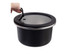 A round, black stainless steel container with a clear lid and a handle. Features a sleek design and reflects modern styling.