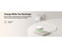A slim, rectangular power bank in white with a charging indication light, placed on a light surface with AirPods on top.