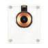 A crystal wireless charger with a clear casing and a circular copper charging pad in the centre.
