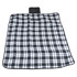 A Leisure Picnic Blanket featuring a classic black and white plaid pattern, designed for outdoor use.