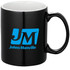 A ceramic coffee mug in black, featuring a blue logo on one side. Packaged in a folded box.