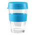 A reusable coffee cup in clear glass with a blue silicone lid and sleeve. It features a logo.